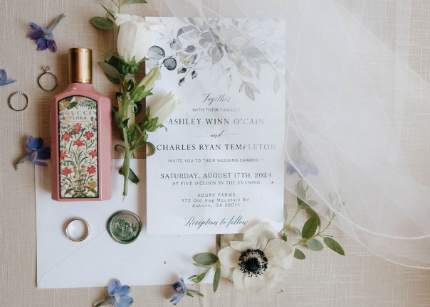 wedding invitations with perfume, florals and rings